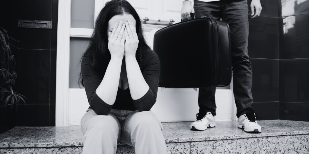 A man with a briefcase leaving a building, while the woman seem to be crying.
How long does a divorce take in South Africa?